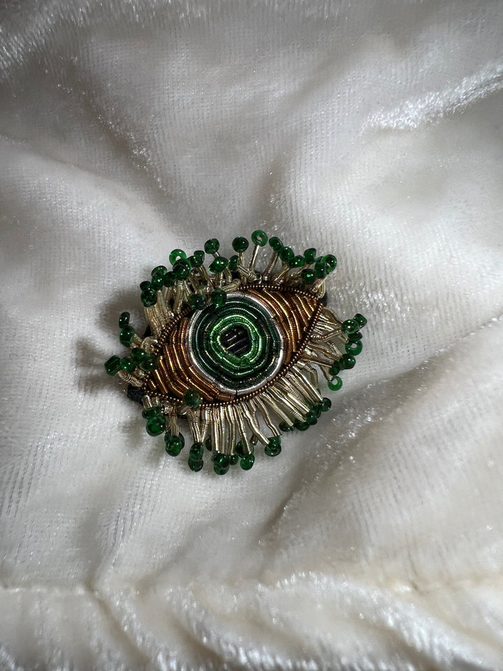 broche eye verte